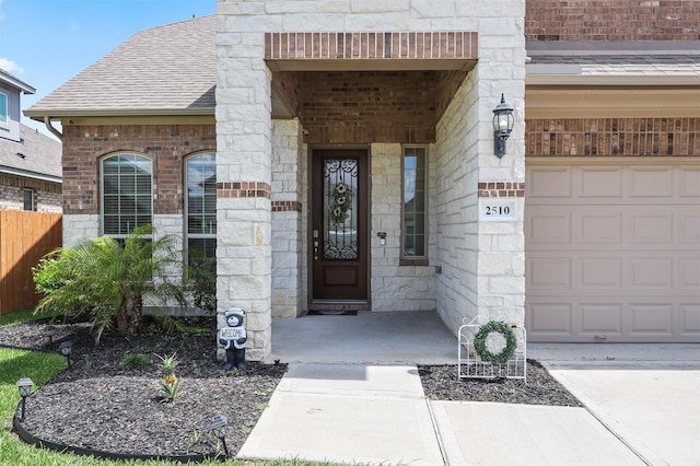 2510 Ocean Key Dr, Texas City, TX 77568 - property entrance featuring stone siding, a shingled roof, and brick siding