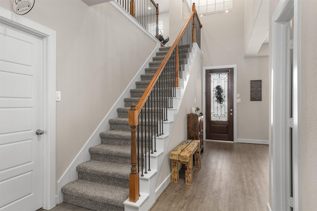 2510 Ocean Key Dr, Texas City, TX 77568 - foyer entrance with baseboards, wood finished floors, stairs, and a high ceiling