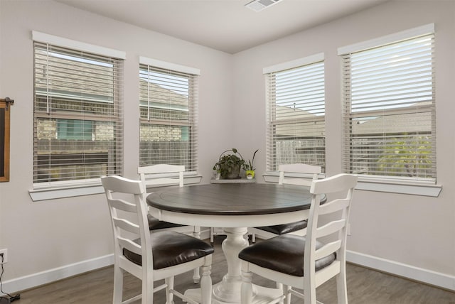 2510 Ocean Key Dr, Texas City, TX 77568 - dining space with baseboards and wood finished floors