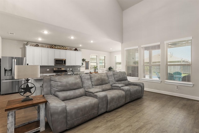 2510 Ocean Key Dr, Texas City, TX 77568 - living area with wood finished floors, recessed lighting, baseboards, and high vaulted ceiling