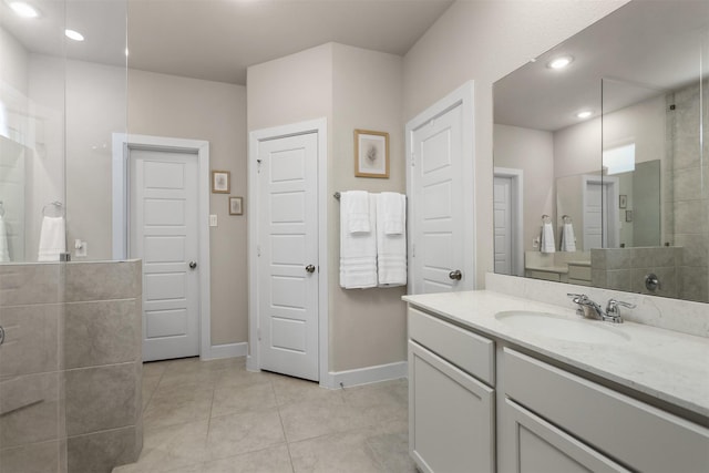 2510 Ocean Key Dr, Texas City, TX 77568 - full bathroom with tile patterned floors, vanity, baseboards, tiled shower, and recessed lighting