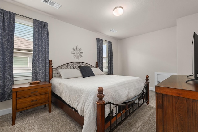 2510 Ocean Key Dr, Texas City, TX 77568 - carpeted bedroom featuring multiple windows and baseboards