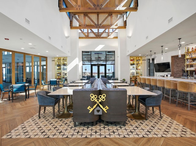 2510 Ocean Key Dr, Texas City, TX 77568 - dining room featuring a high ceiling, a community bar, healthy amount of natural light, and french doors