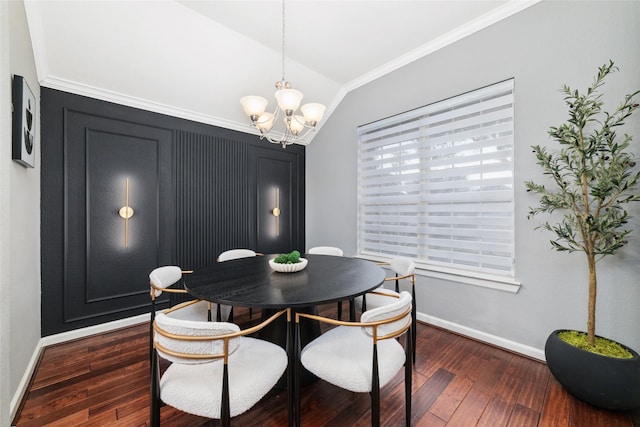 dining area featuring vaulted ceiling, a chandelier, crown molding, dark wood-style flooring, and baseboards