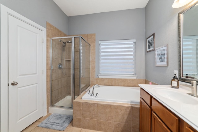 full bath with a shower stall, a bath, tile patterned floors, and vanity