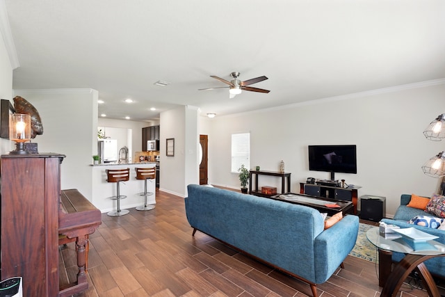 3519 Barkers Run Dr, Houston, TX 77084 - living area featuring crown molding, ceiling fan, dark wood-style flooring, baseboards, and recessed lighting