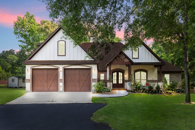 28120 Clint Neidgk Rd, Magnolia, TX 77354 - english style home with french doors, board and batten siding, driveway, and brick siding