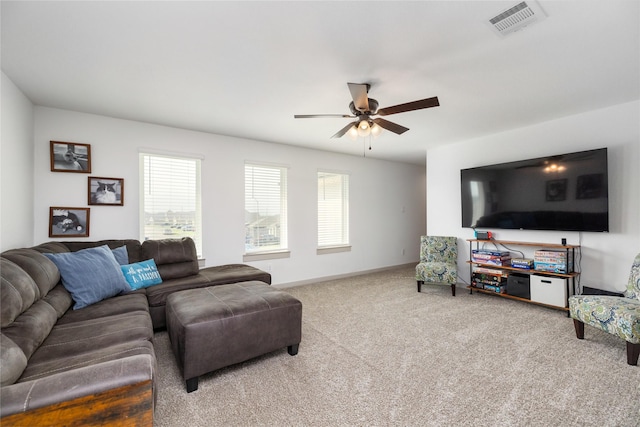 502 Rain Cloud Dr, Baytown, TX 77523 - living area with plenty of natural light, carpet floors, a ceiling fan, and baseboards