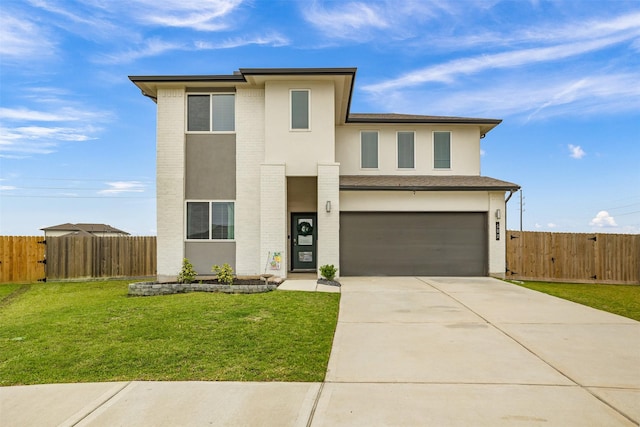 502 Rain Cloud Dr, Baytown, TX 77523 - view of front of home with a garage, driveway, and stucco siding