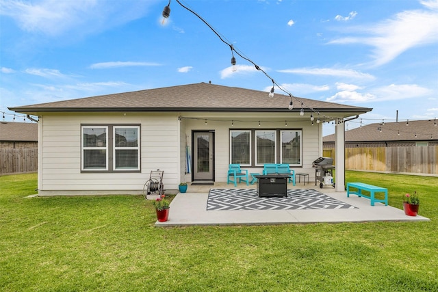 502 Rain Cloud Dr, Baytown, TX 77523 - rear view of property featuring a patio and an outdoor fire pit