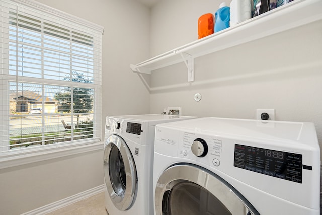 11707 Finnick Bend Dr, Tomball, TX 77377 - clothes washing area featuring washing machine and dryer and baseboards