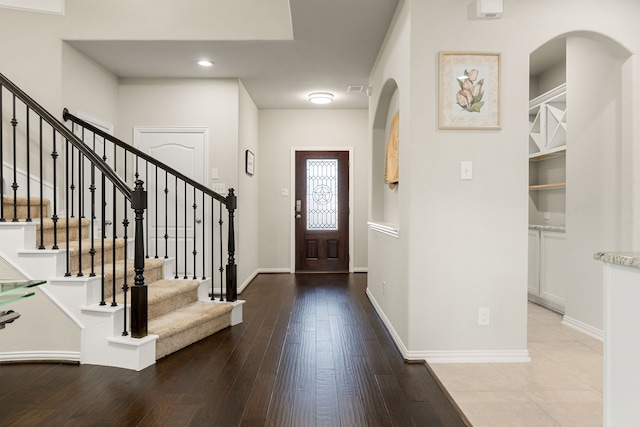 11707 Finnick Bend Dr, Tomball, TX 77377 - entrance foyer featuring arched walkways, hardwood / wood-style flooring, stairway, baseboards, and recessed lighting