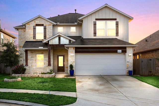 11707 Finnick Bend Dr, Tomball, TX 77377 - view of front of home with stone siding, board and batten siding, a garage, and driveway