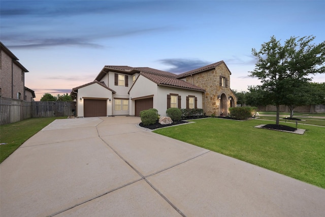 5502 Charlton Ridge Ln, Fulshear, TX 77441 - mediterranean / spanish house with a garage, stone siding, driveway, a tiled roof, and stucco siding