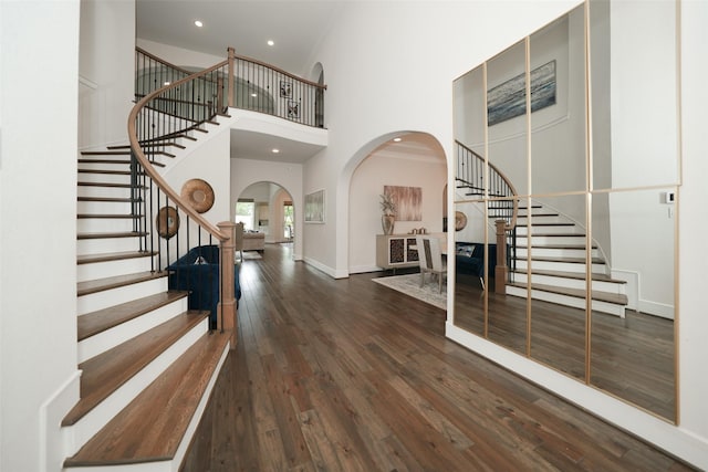 5502 Charlton Ridge Ln, Fulshear, TX 77441 - entryway featuring arched walkways, stairway, a high ceiling, wood finished floors, and recessed lighting