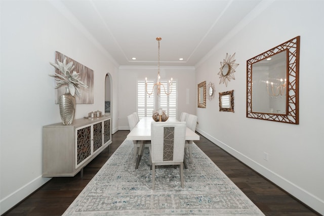 5502 Charlton Ridge Ln, Fulshear, TX 77441 - dining area with a chandelier, arched walkways, baseboards, dark wood finished floors, and ornamental molding