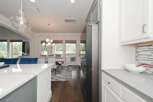 5502 Charlton Ridge Ln, Fulshear, TX 77441 - kitchen with freestanding refrigerator, plenty of natural light, dark wood-style floors, light countertops, and ornamental molding