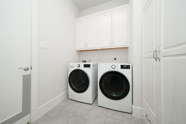 5502 Charlton Ridge Ln, Fulshear, TX 77441 - laundry area featuring cabinet space, independent washer and dryer, baseboards, and light tile patterned floors