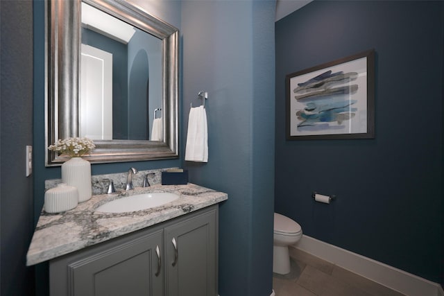 5502 Charlton Ridge Ln, Fulshear, TX 77441 - half bathroom featuring toilet, vanity, tile patterned floors, and baseboards