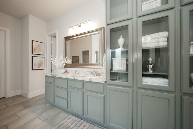 5502 Charlton Ridge Ln, Fulshear, TX 77441 - full bathroom with baseboards, vanity, and wood finished floors