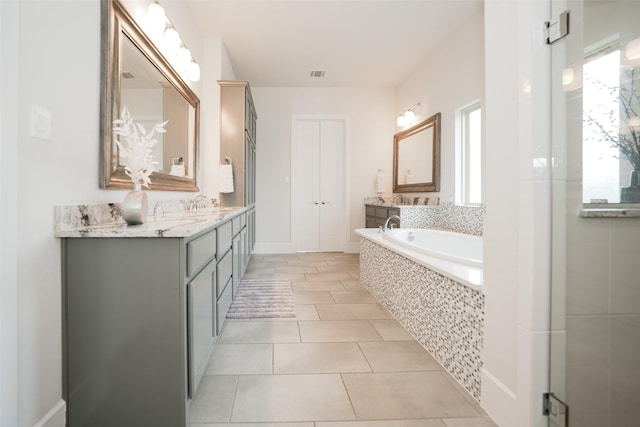 5502 Charlton Ridge Ln, Fulshear, TX 77441 - full bath featuring a garden tub, vanity, tile patterned floors, and baseboards