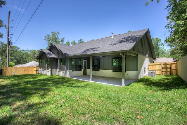 1973 Greentree Dr, Huntsville, TX 77340 - rear view of property featuring brick siding, roof with shingles, a patio, and a fenced backyard