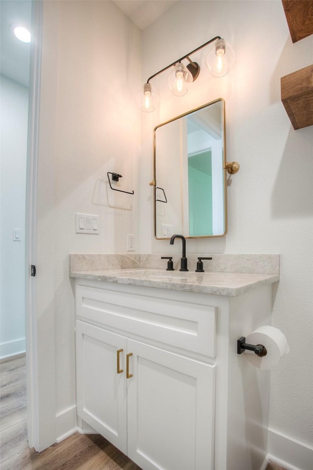 1973 Greentree Dr, Huntsville, TX 77340 - bathroom featuring wood finished floors and vanity