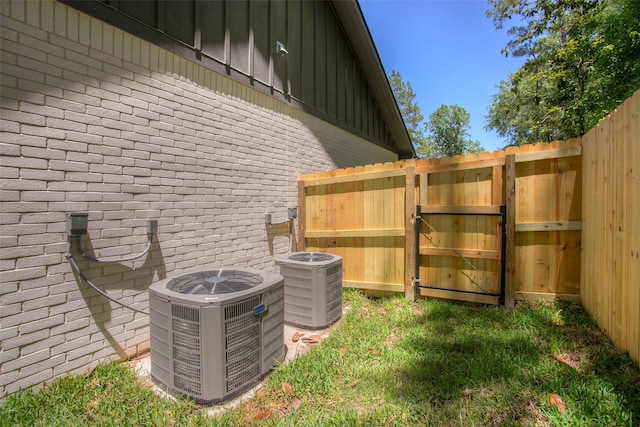 1973 Greentree Dr, Huntsville, TX 77340 - exterior view of brick siding, board and batten siding, and a gate