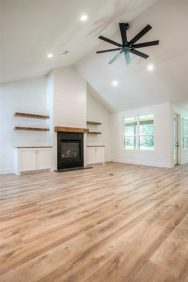 1973 Greentree Dr, Huntsville, TX 77340 - unfurnished living room with light wood-type flooring, a large fireplace, recessed lighting, lofted ceiling, and ceiling fan