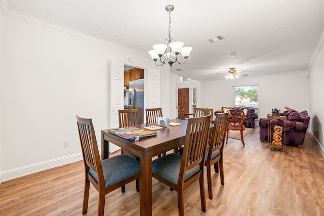 12114 Paddock Way, Houston, TX 77065 - dining space featuring light wood-type flooring, a chandelier, baseboards, a ceiling fan, and crown molding