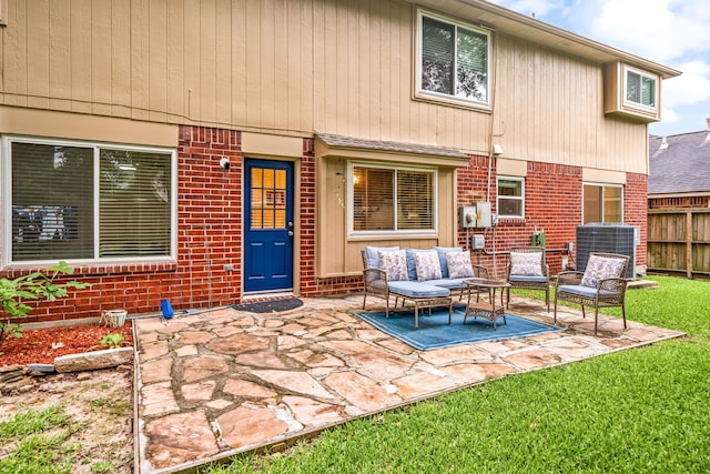 12114 Paddock Way, Houston, TX 77065 - back of property featuring brick siding, a patio, outdoor lounge area, and cooling unit