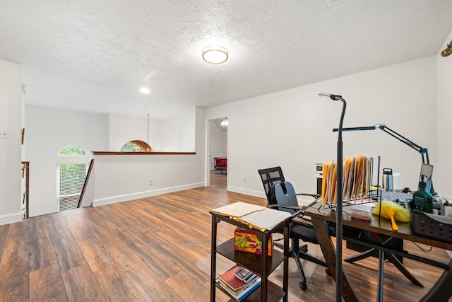 12114 Paddock Way, Houston, TX 77065 - home office with wood finished floors, a textured ceiling, and baseboards