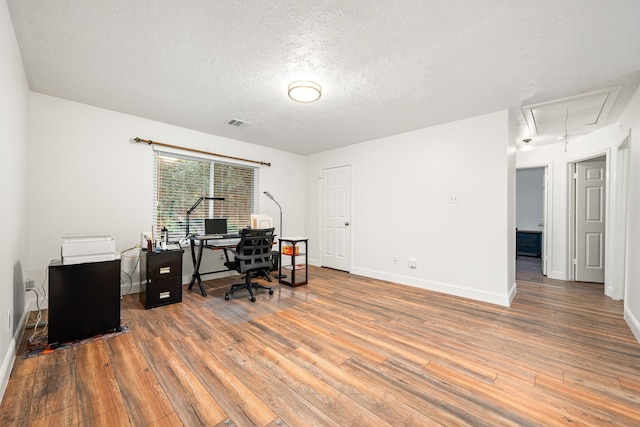 12114 Paddock Way, Houston, TX 77065 - office space with attic access, wood-type flooring, a textured ceiling, and baseboards