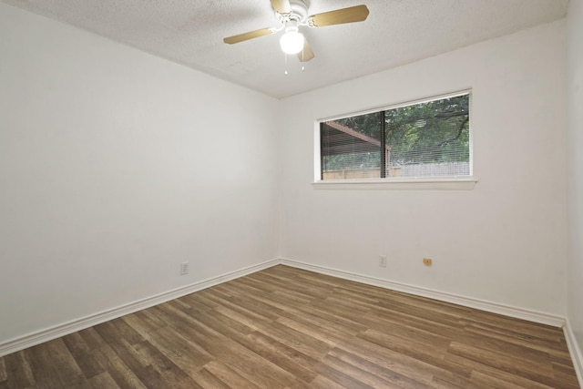 1926 Klauke Ct, Rosenberg, TX 77471 - unfurnished room with wood finished floors, baseboards, a textured ceiling, and a ceiling fan