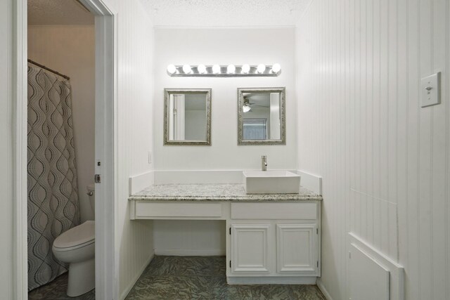 1926 Klauke Ct, Rosenberg, TX 77471 - bathroom with vanity, toilet, a textured ceiling, and a shower with shower curtain