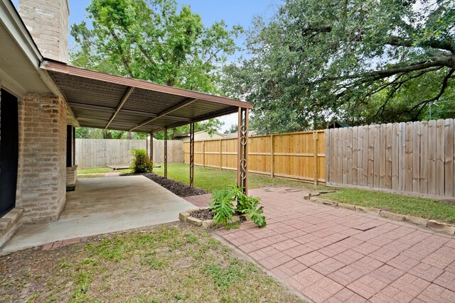 1926 Klauke Ct, Rosenberg, TX 77471 - fenced backyard with a patio area