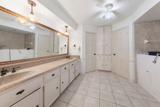 6131 Knollview Dr, Spring, TX 77389 - bathroom with ceiling fan, tile patterned flooring, double vanity, and a shower
