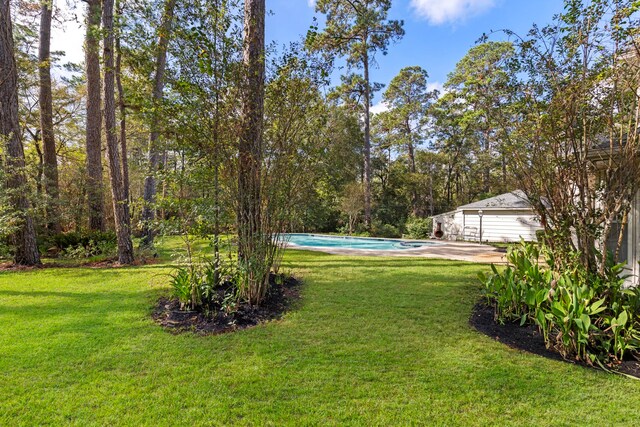 6131 Knollview Dr, Spring, TX 77389 - view of green lawn with an outdoor pool and a patio area