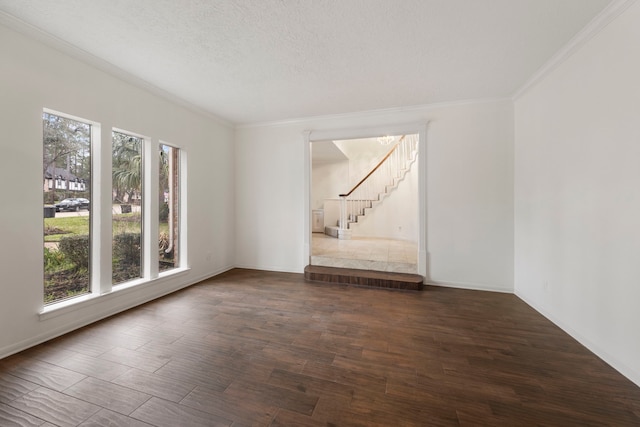 6131 Knollview Dr, Spring, TX 77389 - spare room featuring stairs, crown molding, dark wood-style floors, baseboards, and a textured ceiling