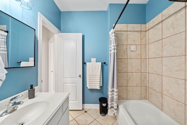full bath with tile patterned flooring, shower / tub combo, vanity, and baseboards