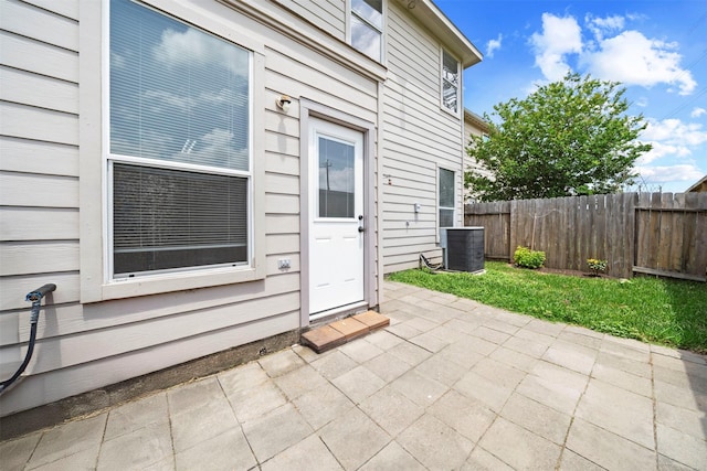 view of patio / terrace with fence and central AC