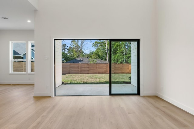 1420 Flamingo St, Conroe, TX 77385 - entryway featuring plenty of natural light, wood finished floors, baseboards, and recessed lighting