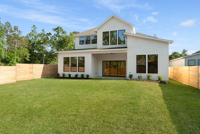 rear view of property with a shingled roof