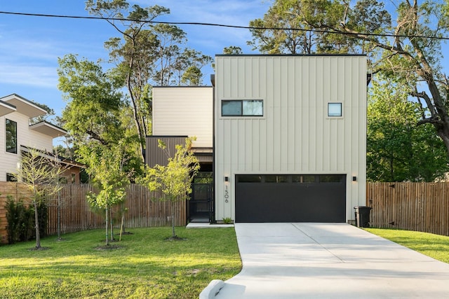 view of front facade with board and batten siding, a garage, and concrete driveway
