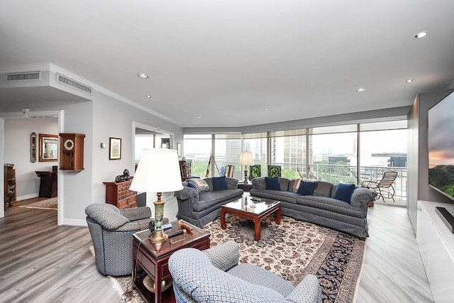 5050 Woodway Dr Unit 7L, Houston, TX 77056 - living room featuring light wood-style floors, baseboards, recessed lighting, and ornamental molding