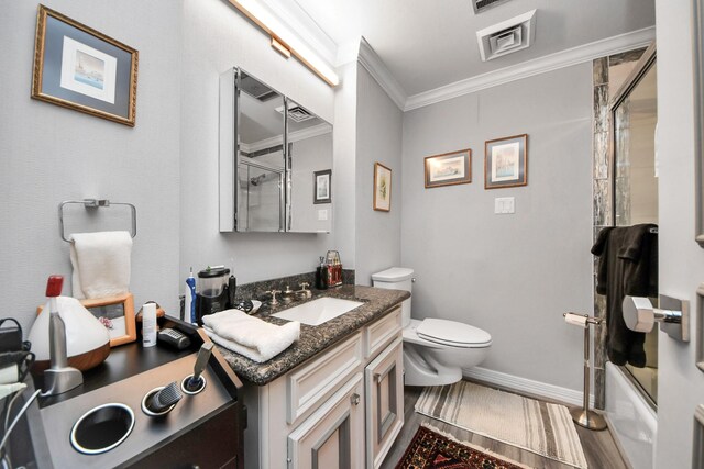 5050 Woodway Dr Unit 7L, Houston, TX 77056 - bathroom with crown molding, vanity, toilet, baseboards, and shower / bath combination with glass door