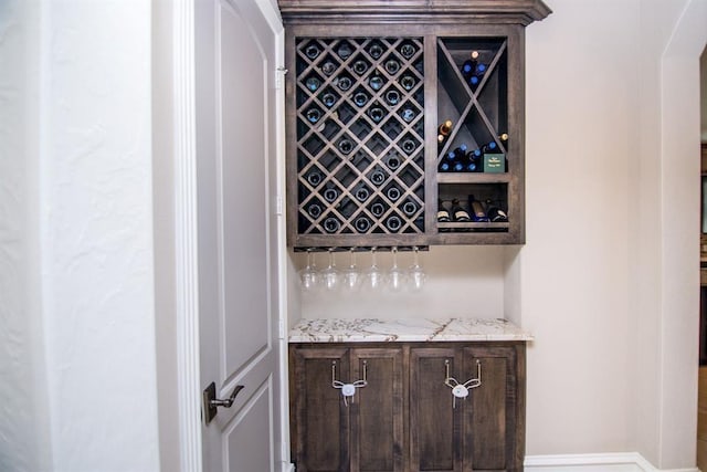 14115 Woodthorpe Ln, Houston, TX 77079 - wine area featuring a dry bar and baseboards