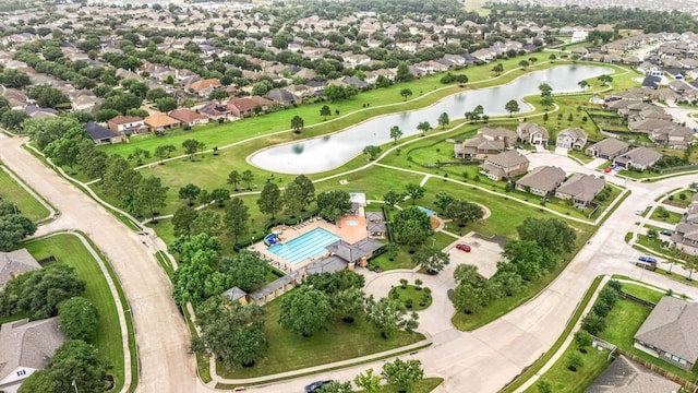 view of property location with nearby suburban area and a pool