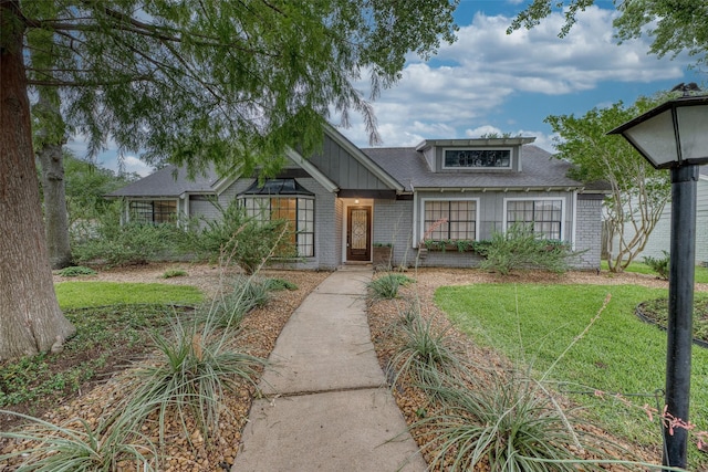 4650 Hickory Downs Dr, Houston, TX 77084 - view of front of property featuring brick siding, a shingled roof, and a front yard