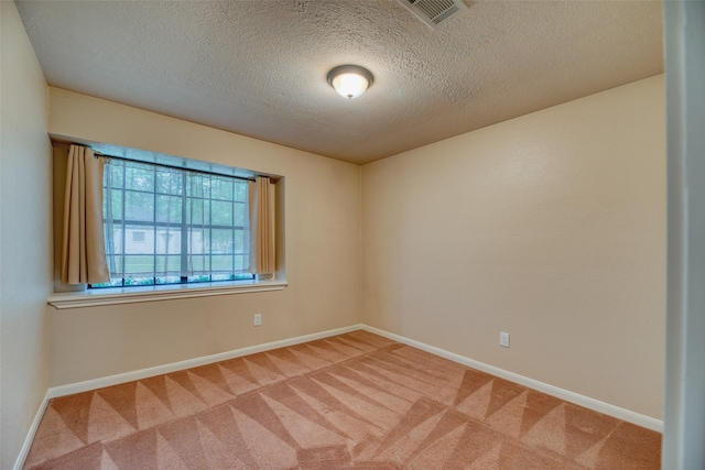 4650 Hickory Downs Dr, Houston, TX 77084 - carpeted empty room with a textured ceiling and baseboards